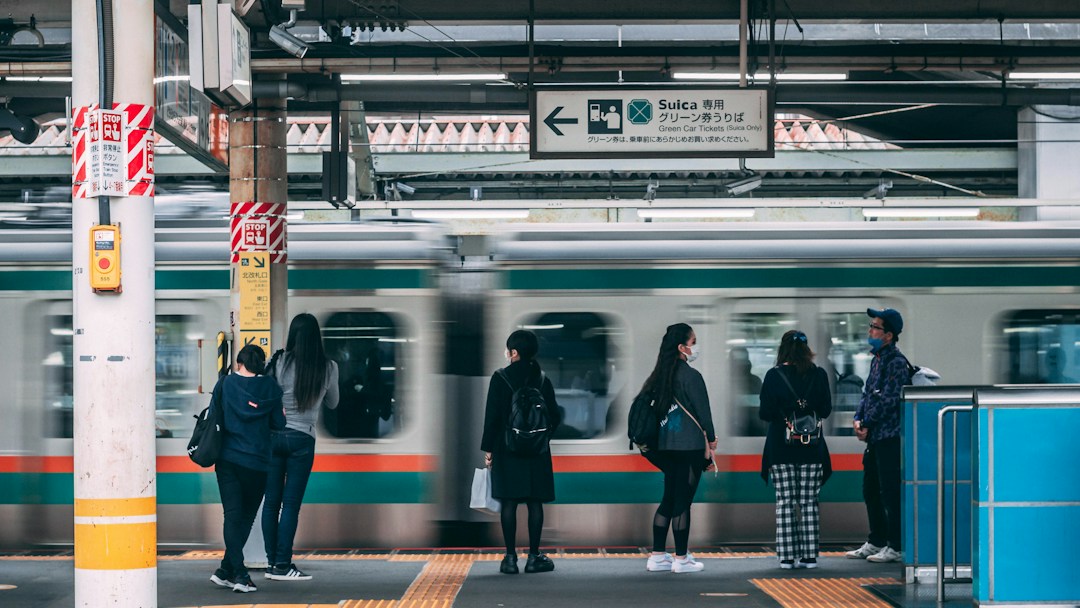 Traveler with luggage at a Japanese train station