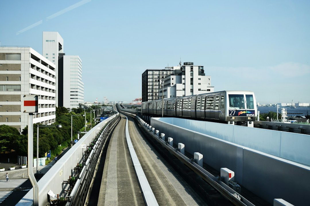 Japanese train traveling through Tokyo, illustrating Haneda airport rail connections